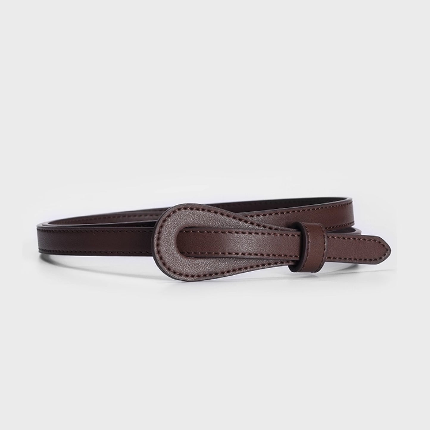 Brown leather belt on a light gray background