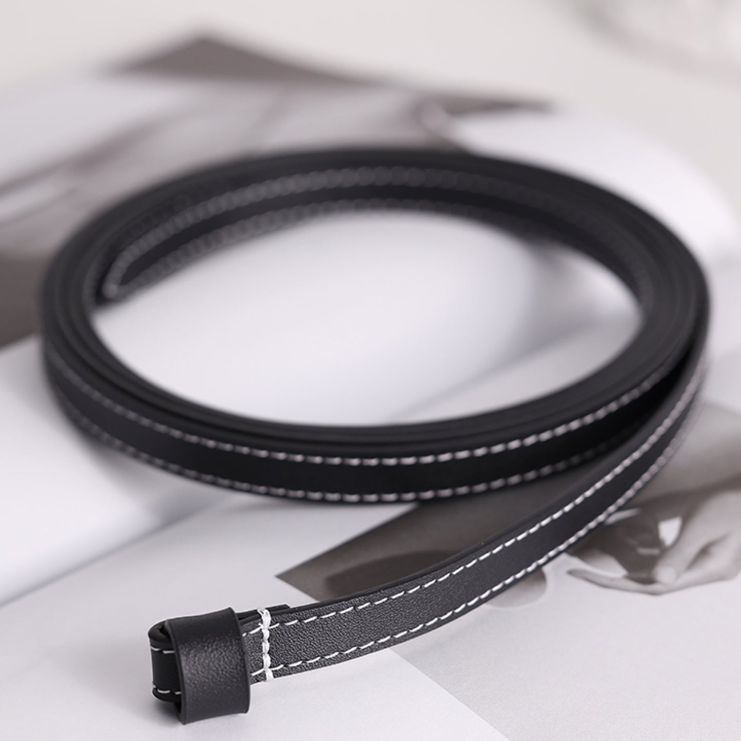 Black and gray cable on a white surface