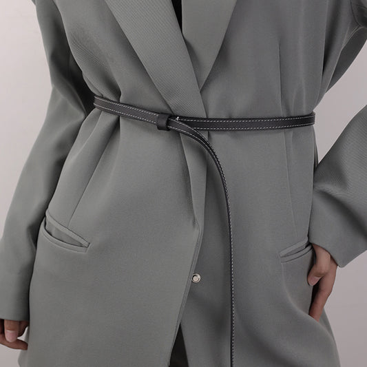 Gray coat with a belt on a plain background