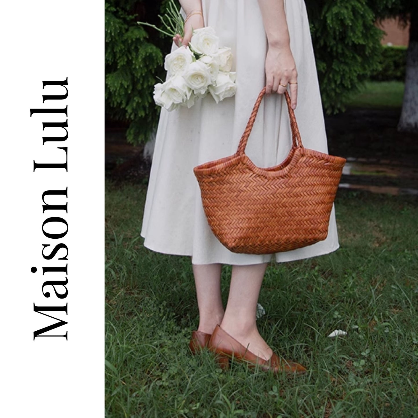 Person holding a woven bag and bouquet of flowers with 'Maison Lulu' branding.