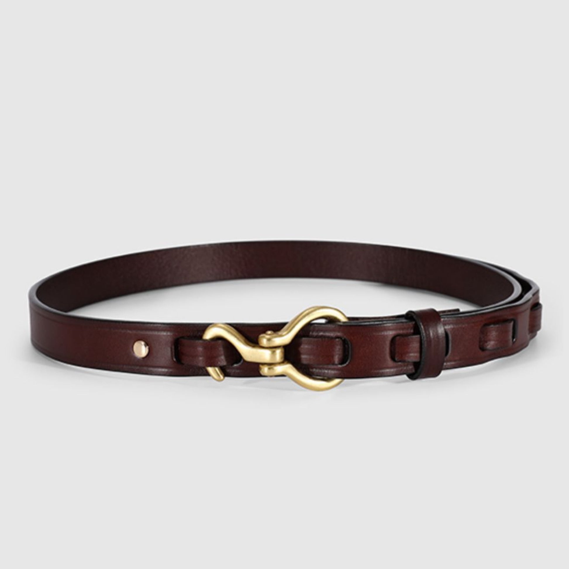 Brown leather belt with a gold buckle on a light gray background