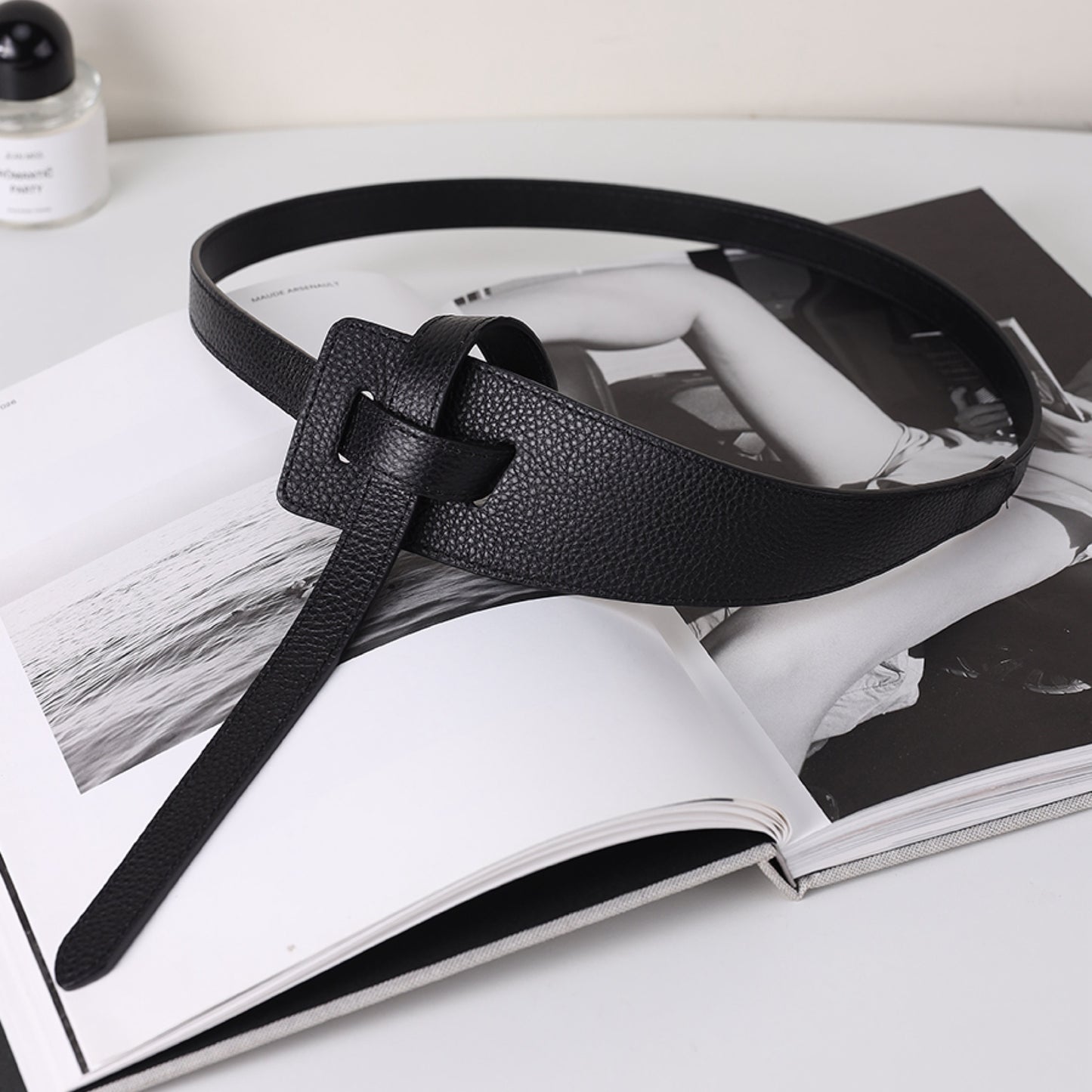 Black leather belt on an open magazine