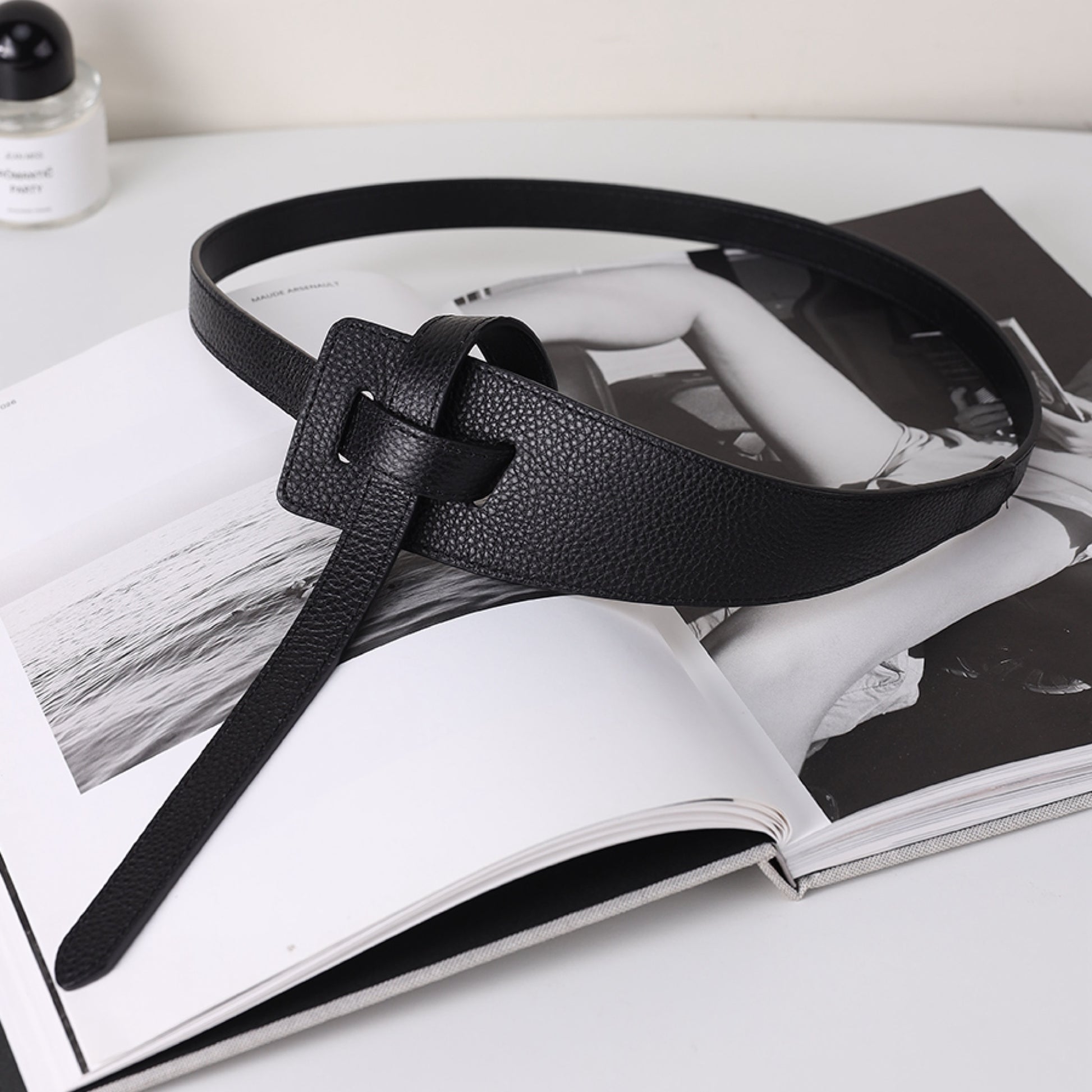 Black leather belt on an open magazine