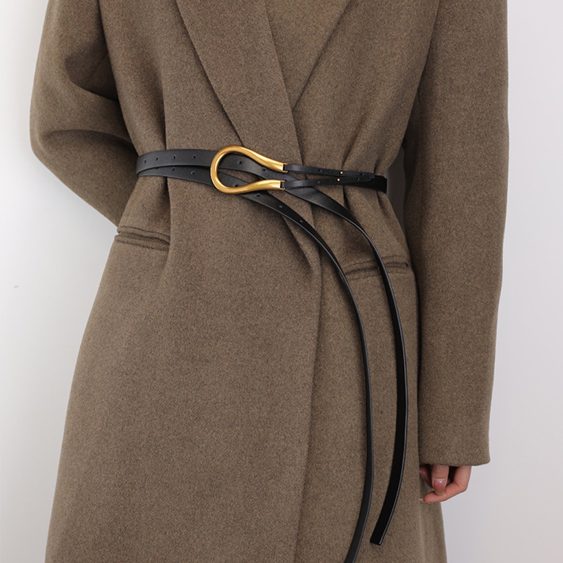Brown coat with a black belt and gold buckle on a white background